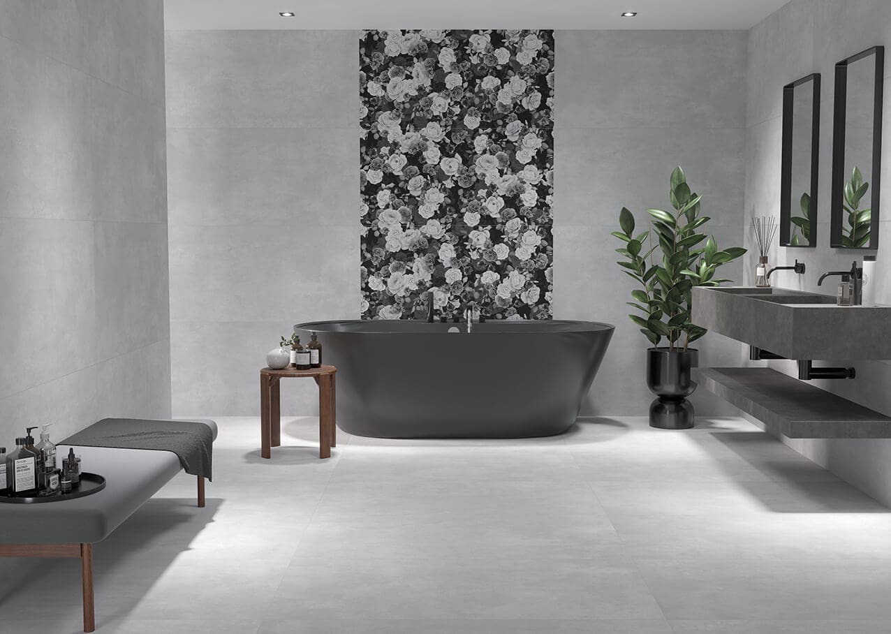 An elegant gray bathtub with floral tile background